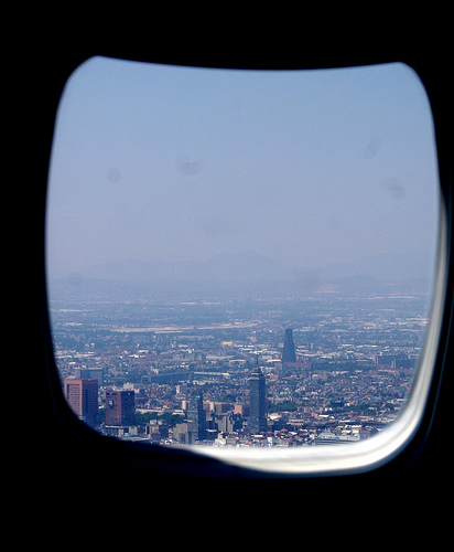 Airplane window view of a city by A30_Tsitika