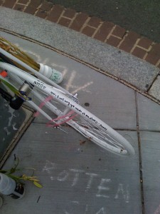 "Alice, I will carry you inside of me, always - Mommy" written on a bicycle tire as a memorial to Alice Swanson, killed by a truck in DC.