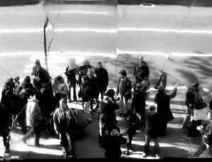 A crowd of people reflected in a mirror