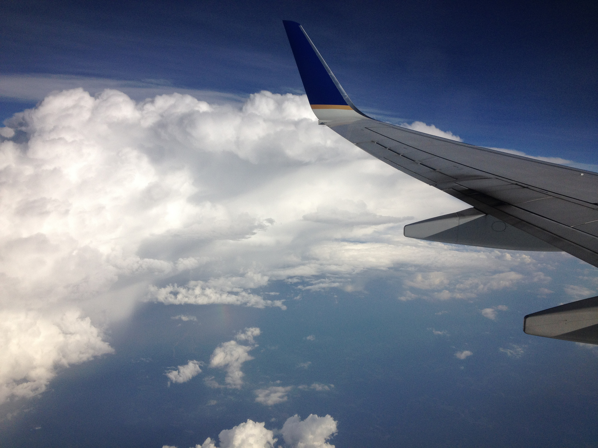 View of clouds and an airplane wing