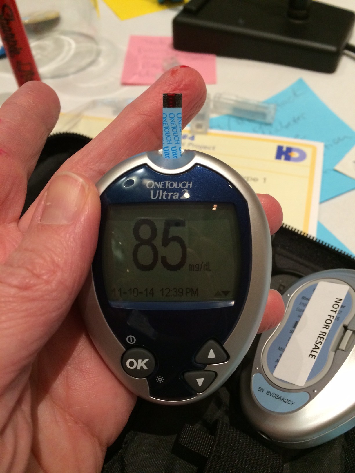 Glucose meter displaying the number 85