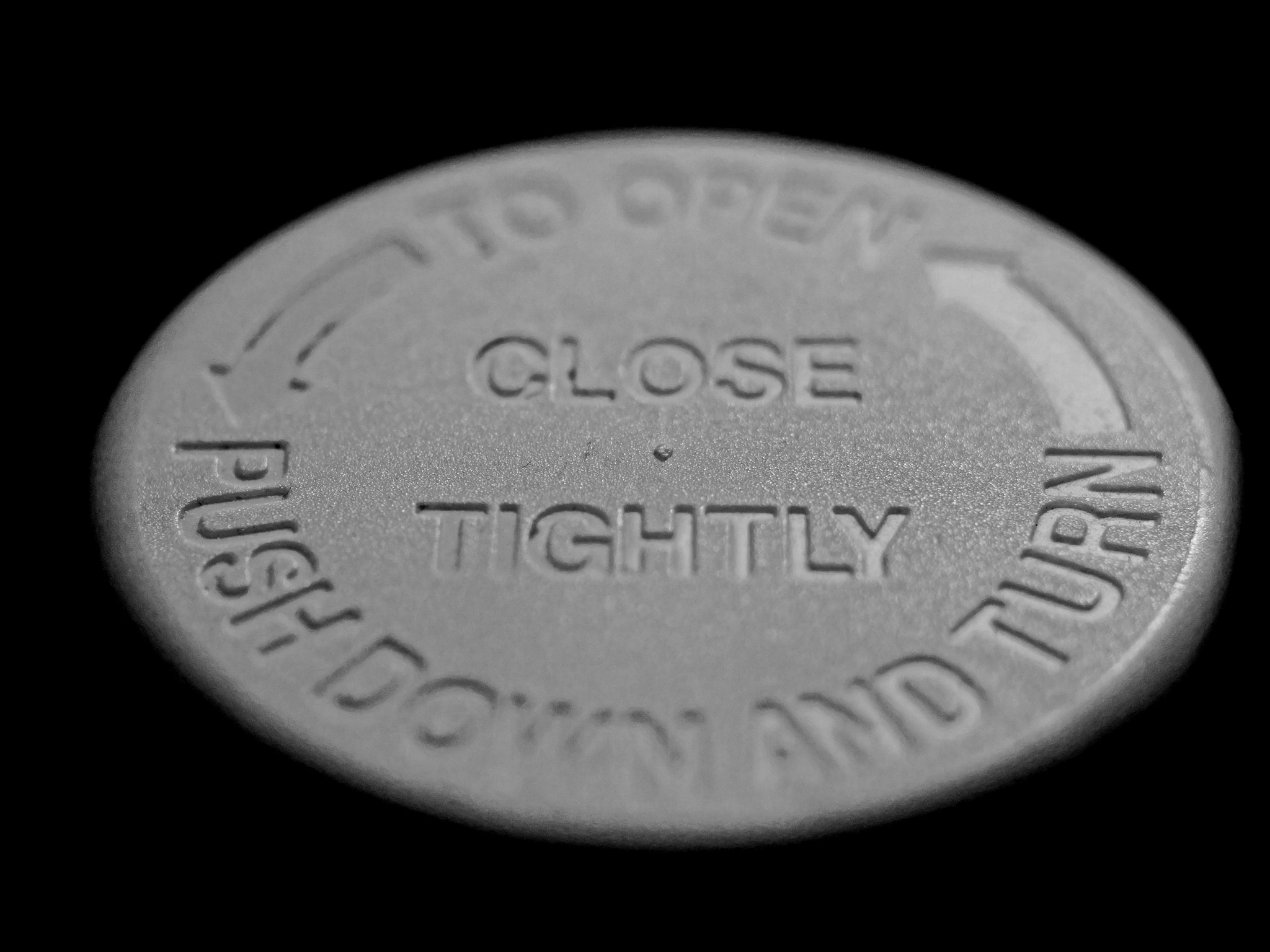 Top of a pill bottle reads "Close Tightly" Image by Are W on flickr