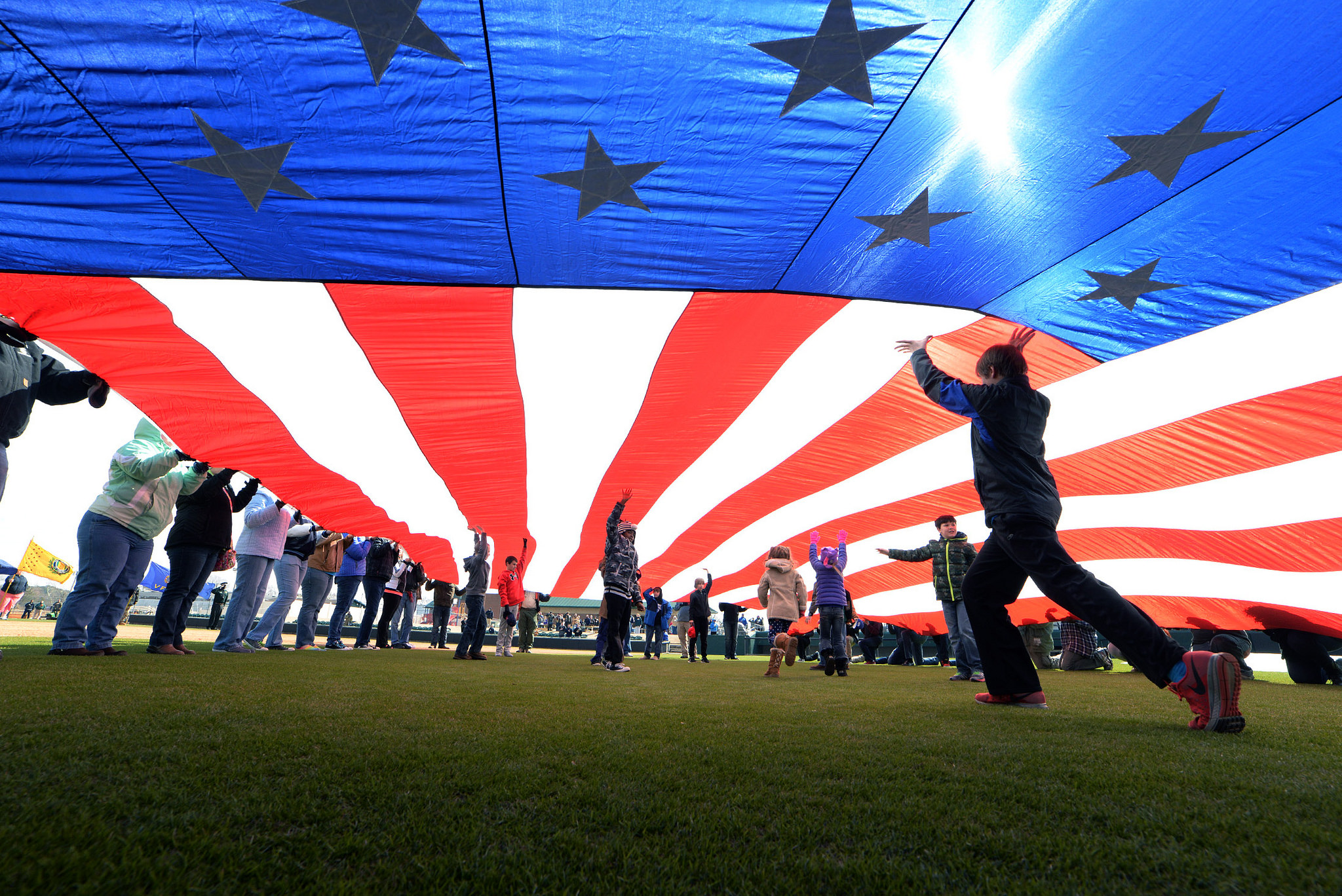 Kids holding up an American flag at the Freedom Classic 2015 by Zach Frailey