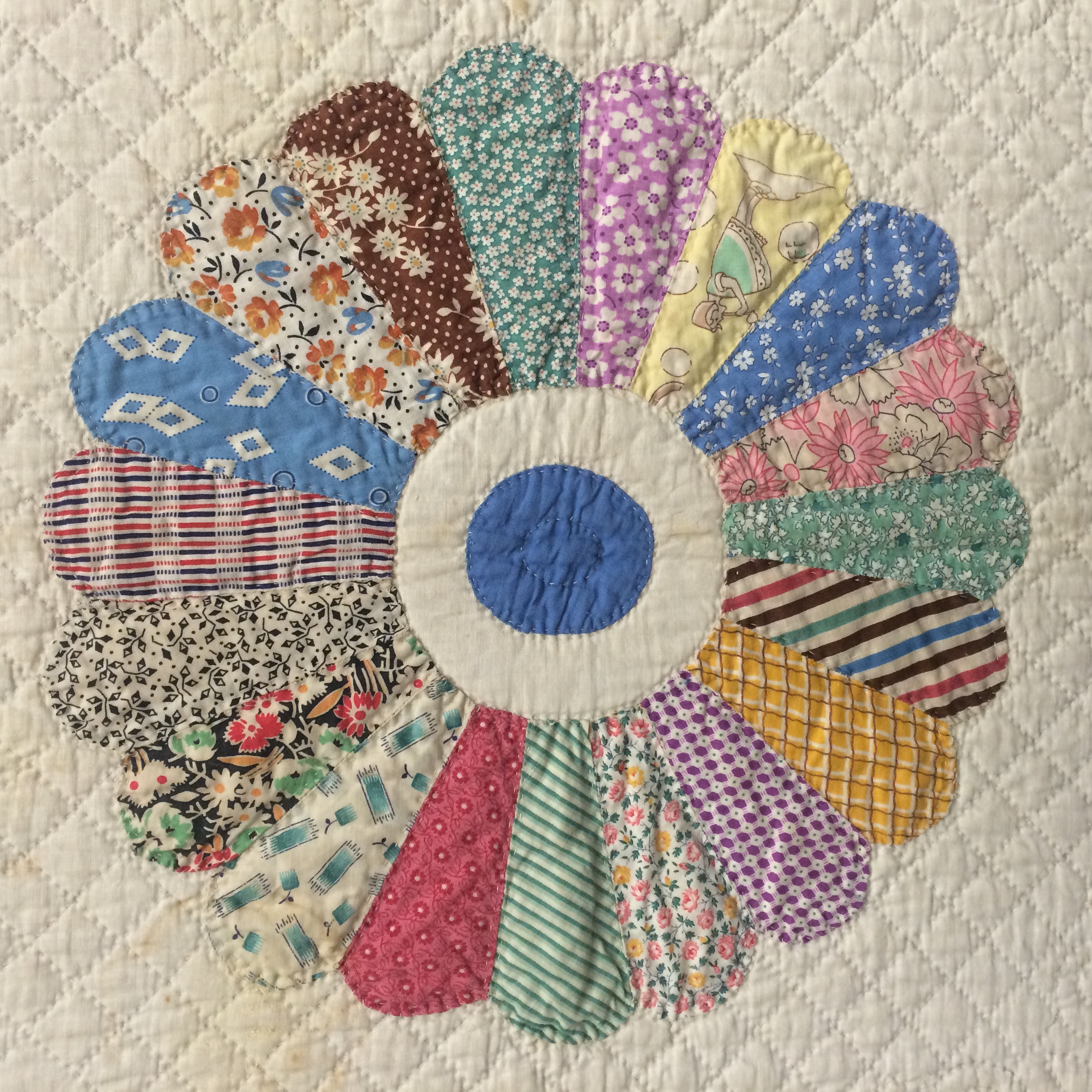 Detail of a quilt square - a multicolor circle