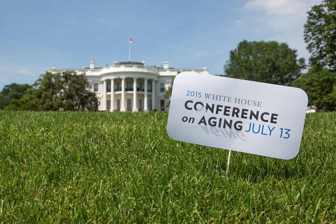 Lawn sign in front of the White House announcing the Conference on Aging July 13