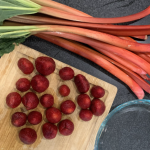 Strawberries, rhubarb, and a glass pie dish